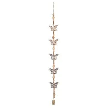 Décoration murale en bois de manguier cérusé blanc motif papillons, perles et clochettes dorées
